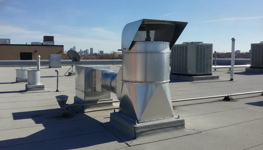 Commercial rooftop upblast exhaust fan installed on a restaurant kitchen roof