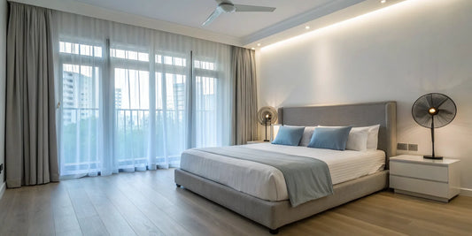 Two of the best fans for a bedroom on nightstands for quiet, cool sleep.