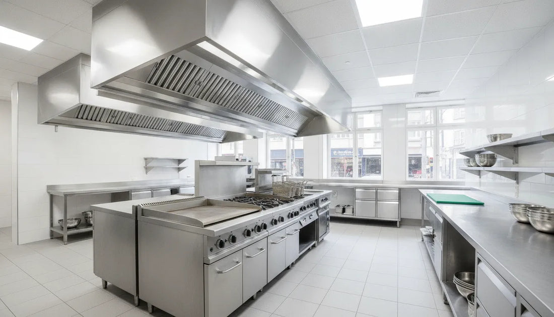 Modern commercial kitchen with stainless steel vent hood and exhaust fan system