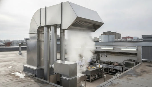 Roof-mounted commercial kitchen exhaust fan venting upward from a restaurant kitchen