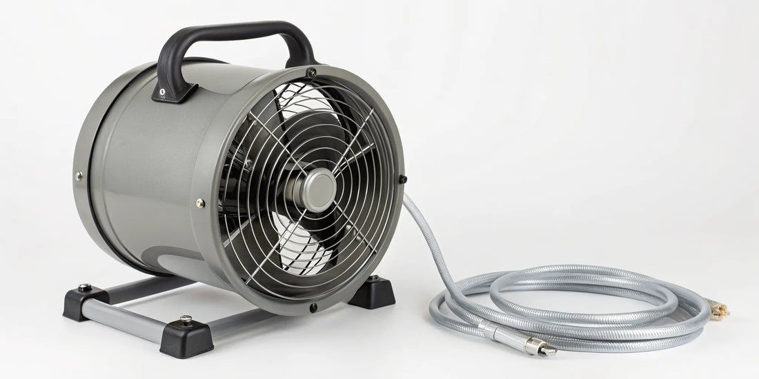 A portable exhaust fan with a flexible hose venting smoke and fumes from a room.
