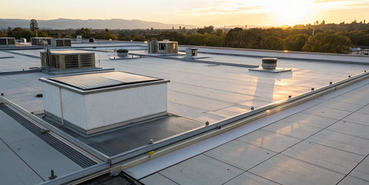 Low profile rooftop extractors installed on a commercial roof.
