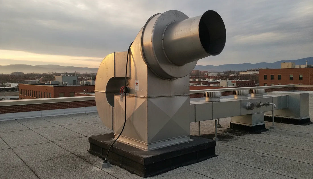 Commercial restaurant exhaust fan mounted on a rooftop with metal ductwork and industrial ventilation system
